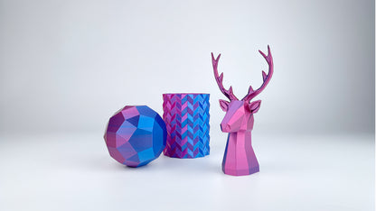 Faceted sphere, geometric vase and low-poly stag 3D printed with EIBOS Silk Series Blue–Fuchsia dual-colour PLA filament.